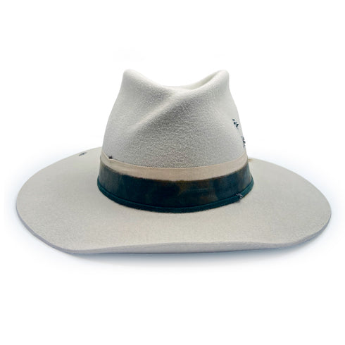 with flattering upturned brim + twist front shaping <span class='visuallyhidden'>Call, text 323-404-2959 for shopping assistance</span>